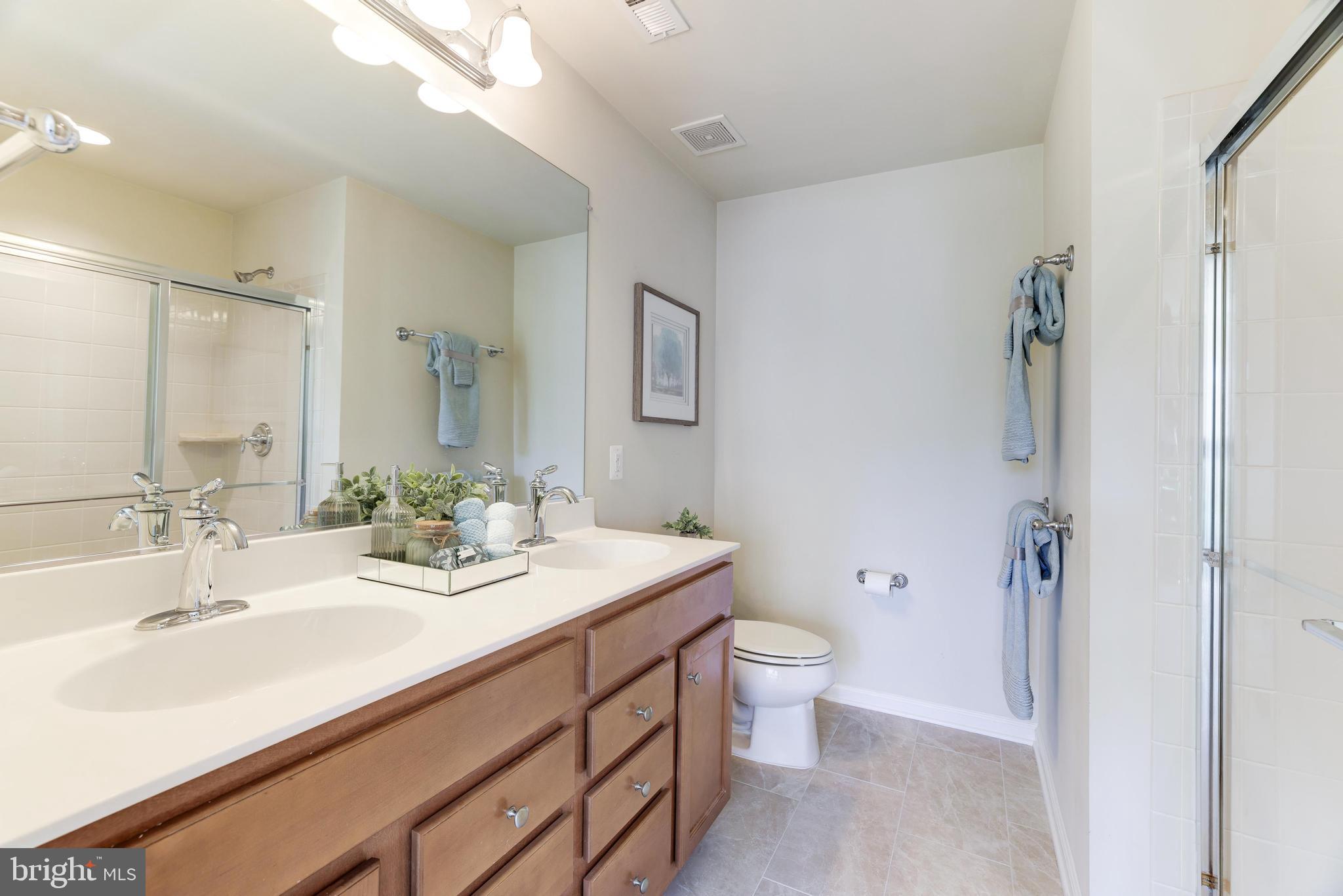 9481 Canonbury Square Fairfax, VA 22031 - Photo 14 of 27 Primary Bath w/ dual sinks, 12x24 tile & shower