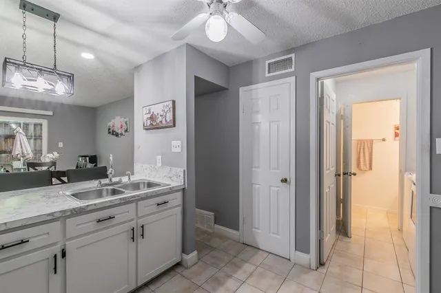 a spacious bathroom with a double vanity sink and a mirror