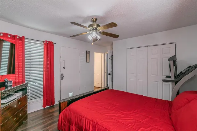 a bed room with a bed and a flat screen tv