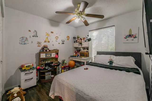 a bedroom with bed and a window