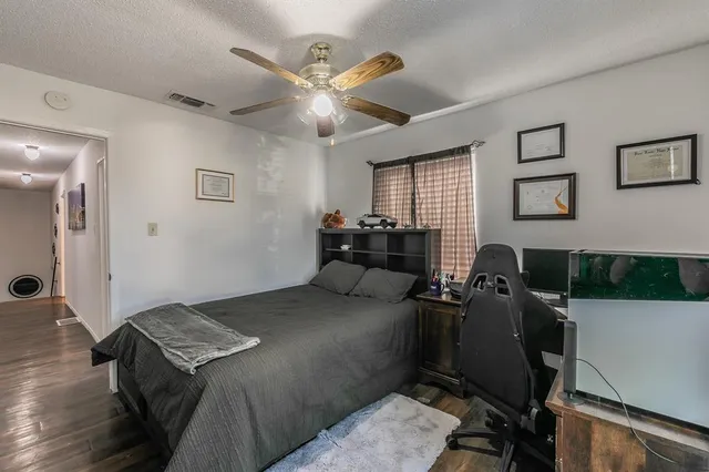 a bedroom with a bed and furniture