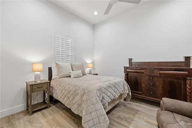 a bedroom with a bed and a lamp