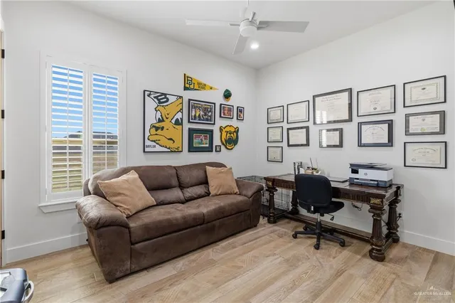 a work room with furniture and a window
