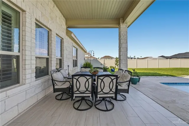 a view of a chairs and tables in patio