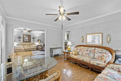 a bedroom with furniture and a wooden floor