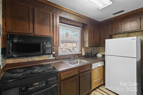 a kitchen with a stove and a refrigerator