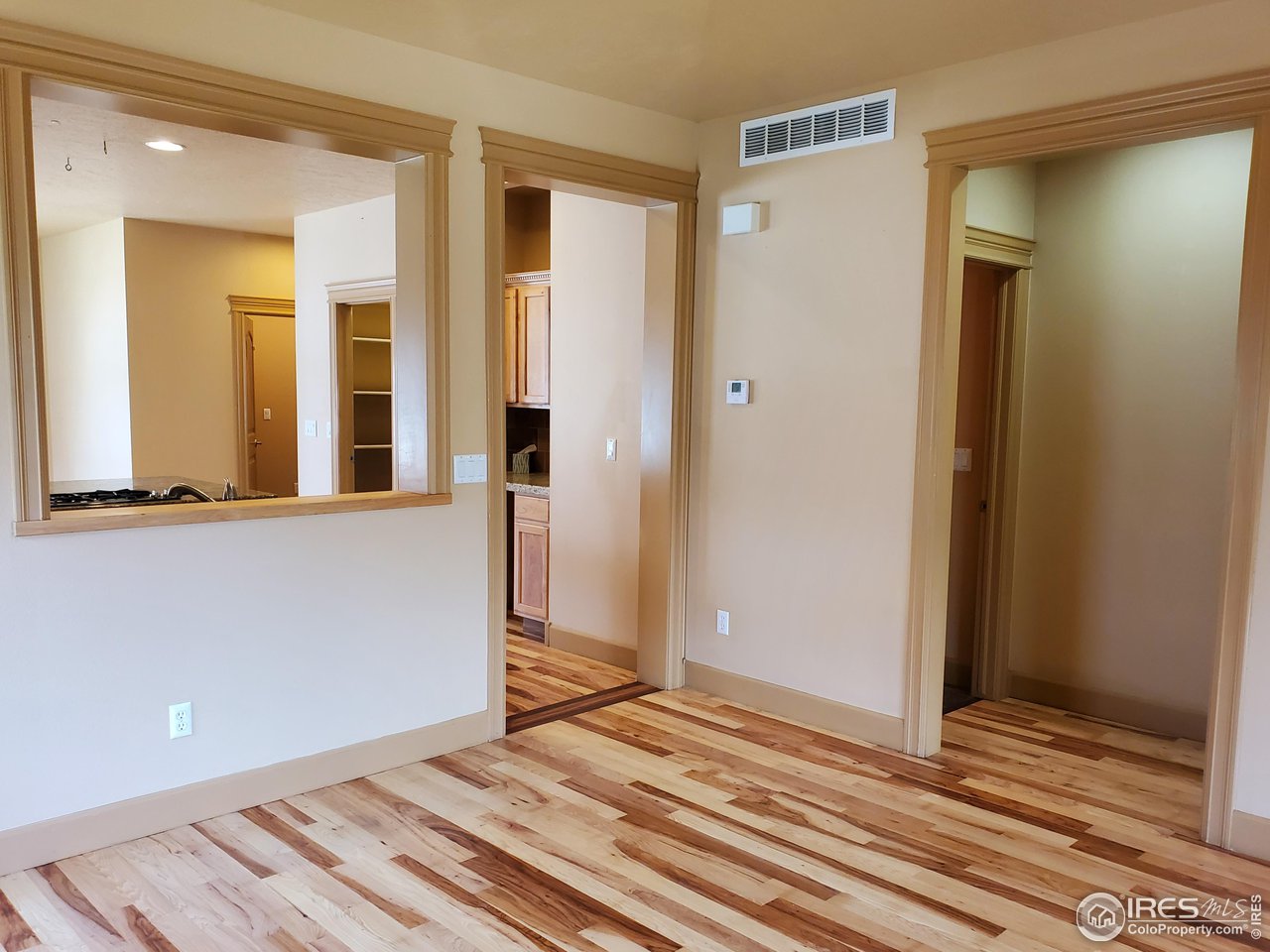 6541 West 18th Street Road Greeley, CO 80634 - Photo 11 of 40 a view of a room with wooden floor and bathroom