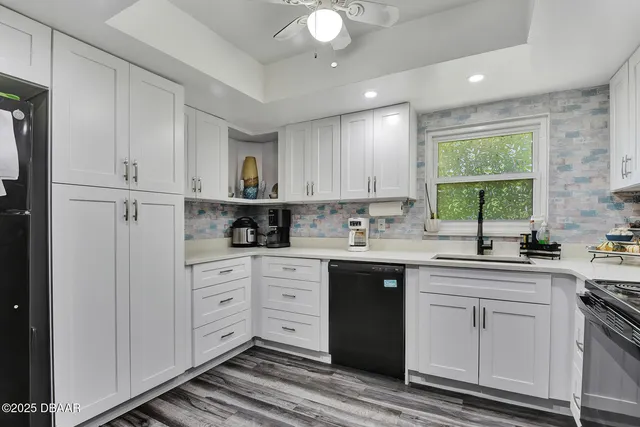 a kitchen with a sink cabinets and window