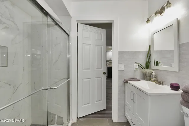 a bathroom with a sink and mirror
