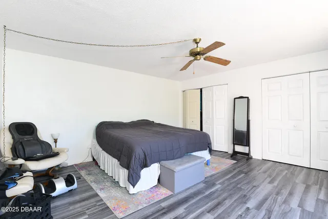 a bedroom with a bed and glass door