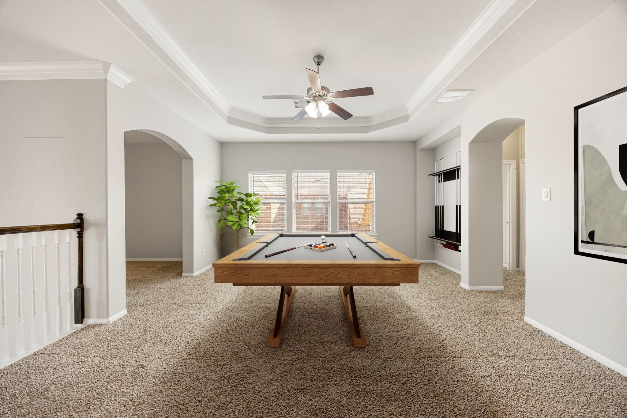 3407 Cardiff Mist Drive Katy, TX 77494 - Photo 16 of 28 Come upstairs and enjoy a day of leisure in this fabulous game room! This is the perfect hangout spot or adult game room, this space features plush carpet, high ceilings, ceiling fan, large windows with blinds, and custom neutral paint. *Virtually staged