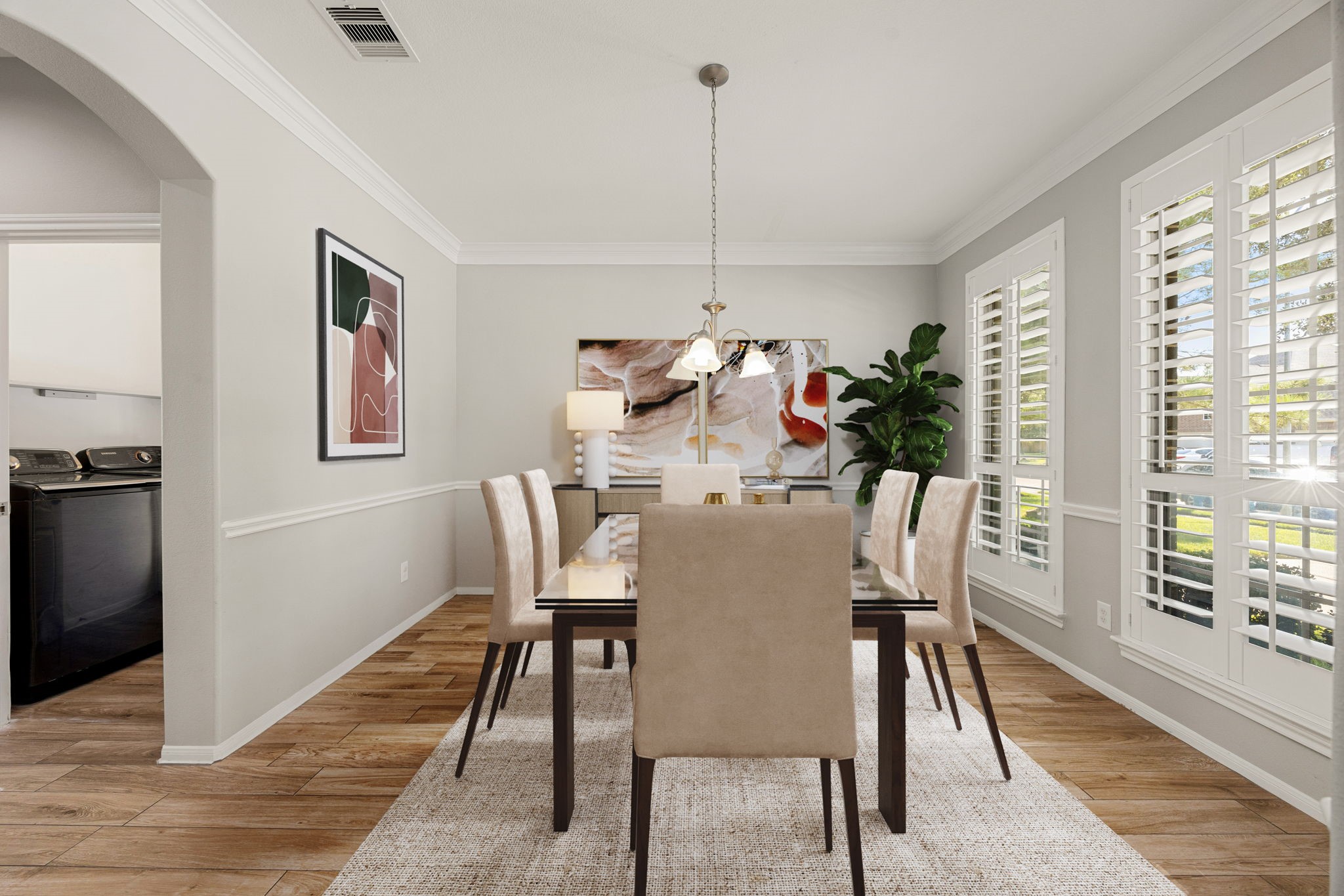 3407 Cardiff Mist Drive Katy, TX 77494 - Photo 6 of 28 Make memories gathered around the table with your family and friends! This dining room features high ceilings, crown molding, chair rail, large windows with blinds, wood look tile flooring and a beautiful chandelier. *Virtually staged