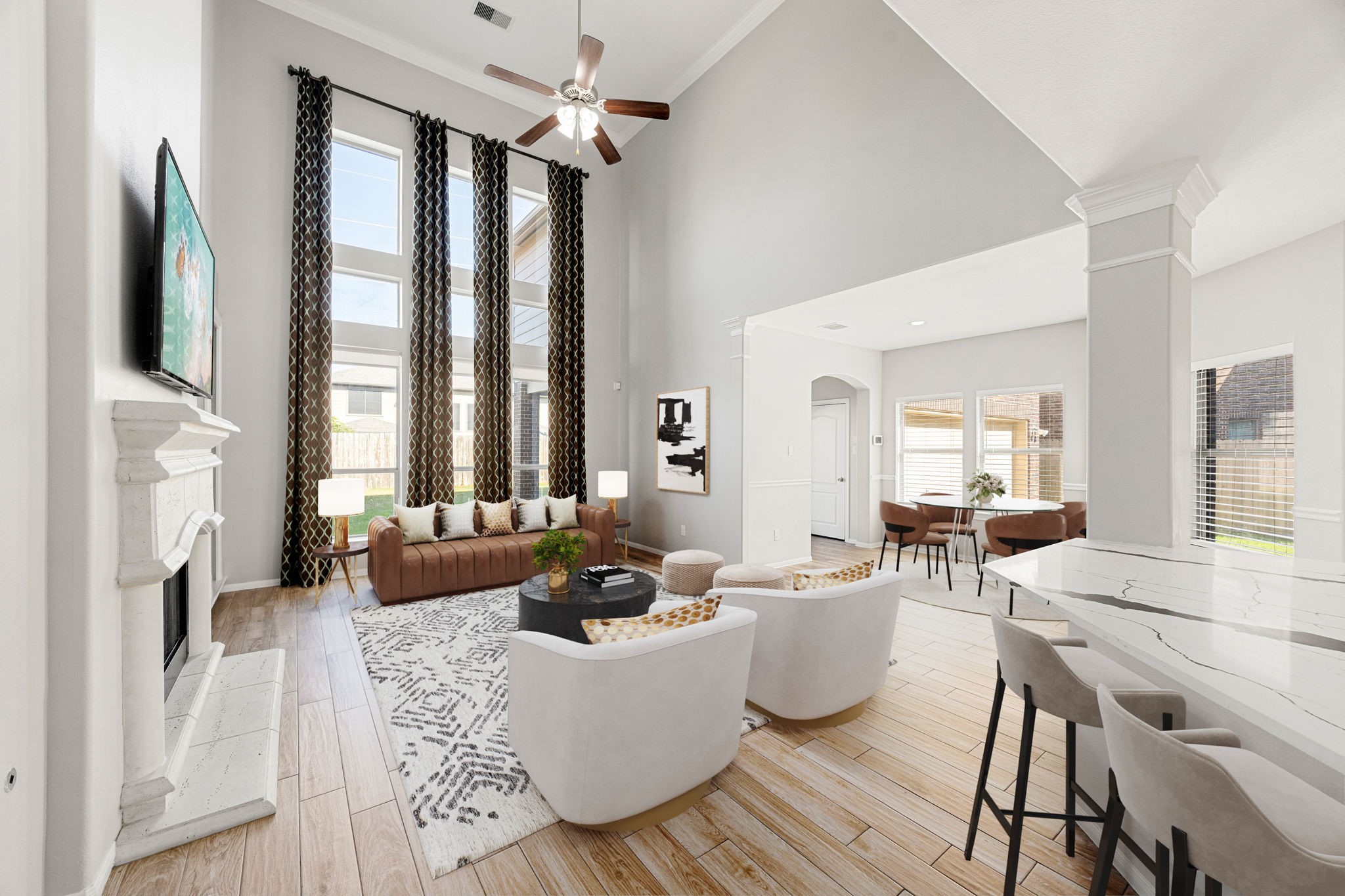 3407 Cardiff Mist Drive Katy, TX 77494 - Photo 7 of 28 The open concept living room, kitchen, and breakfast nook makes for a great way to keep the party going and never miss a beat! Gather the family together in good conversation while preparing a fabulous meal in the breathtaking kitchen! Featuring soaring ceilings, a wall of large windows, dark stained ceiling fan, wood look tile flooring, and neutral custom paint! *Virtually staged