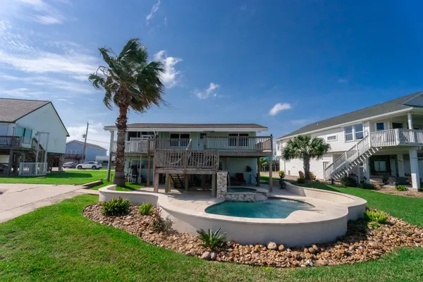 a view of a backyard with a patio