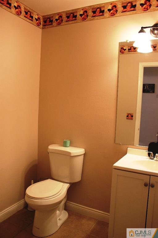140 Redpine Loop Old Bridge, NJ 08857 - Photo 8 of 13 a white toilet sitting next to a bathroom sink