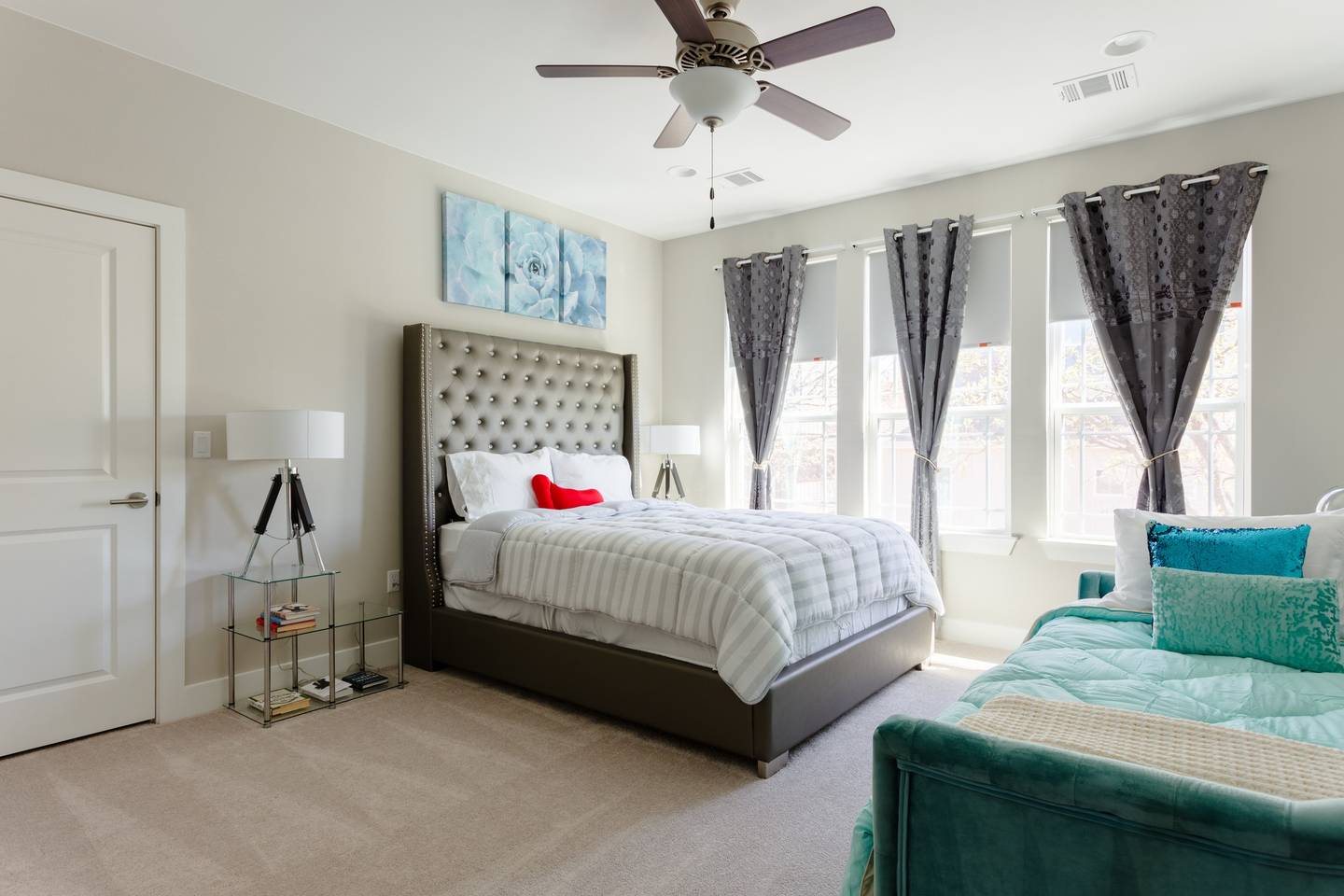 807 East 16th Street, Unit A Austin, TX 78702 - Photo 14 of 29 a bedroom with a bed and a chandelier