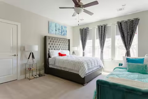 807 East 16th Street, Unit A Austin, TX 78702 - Photo 14 of 29 a bedroom with a bed couch and window