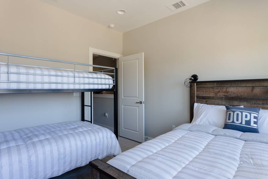 807 East 16th Street, Unit A Austin, TX 78702 - Photo 23 of 29 a bedroom with bed and wooden floor