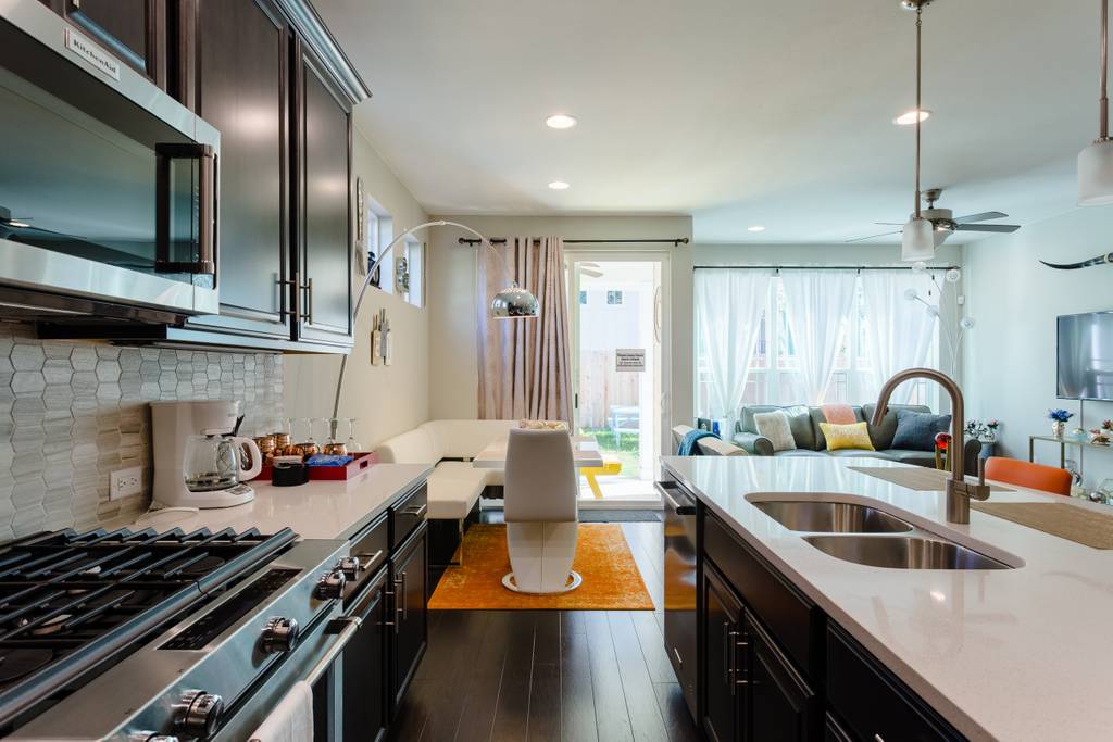 807 East 16th Street, Unit A Austin, TX 78702 - Photo 7 of 29 a kitchen filled counter space a sink and appliances