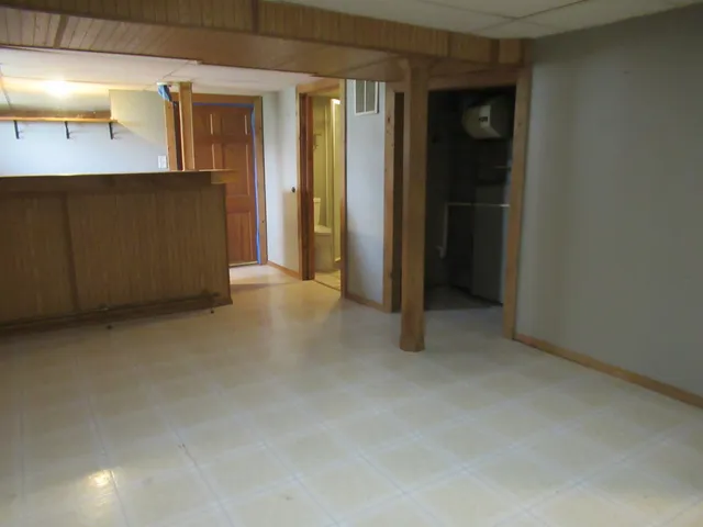 a white toilet sitting next to a shower