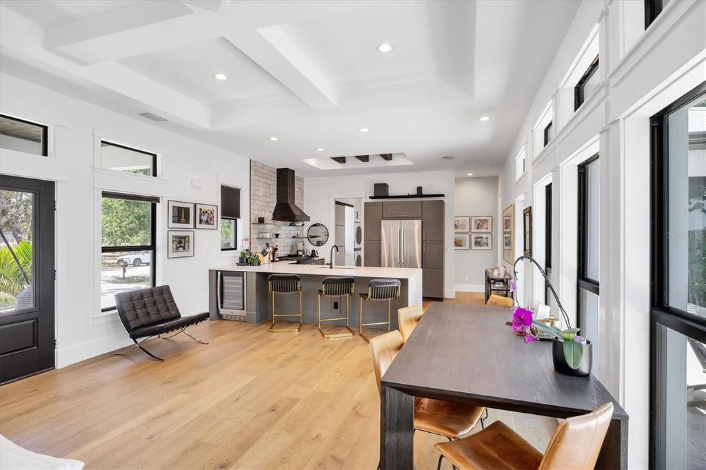 4624 Pompano Street Placida, FL 33946 - Photo 11 of 39 a living room with kitchen island furniture and a flat screen tv