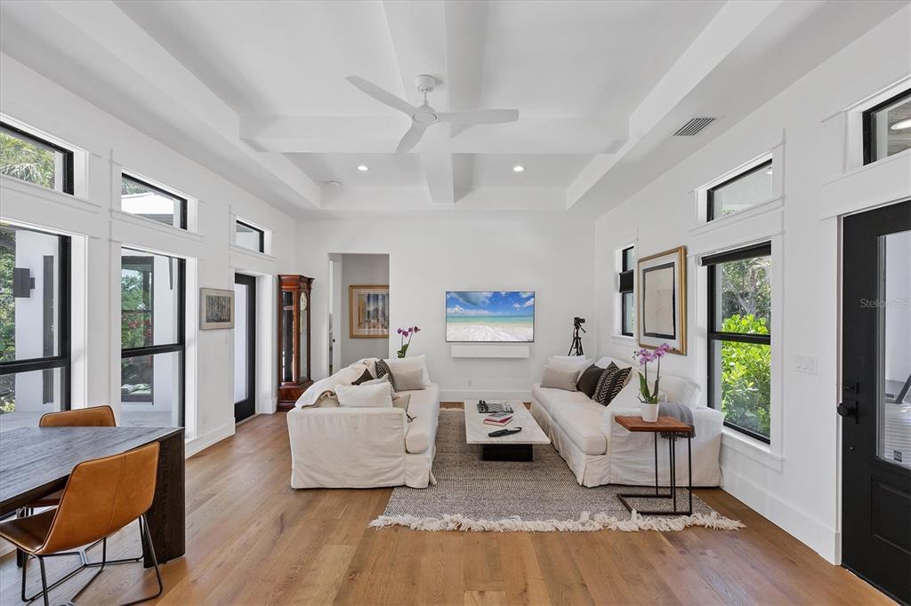 4624 Pompano Street Placida, FL 33946 - Photo 14 of 39 a living room with furniture and a wooden floor
