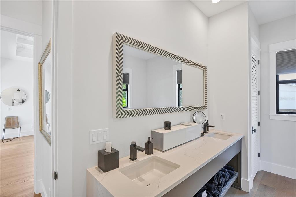 4624 Pompano Street Placida, FL 33946 - Photo 19 of 39 a bathroom with a sink vanity and a mirror