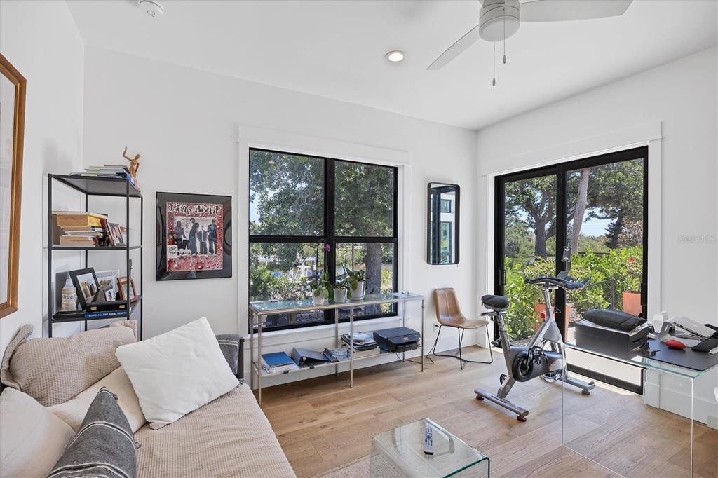 4624 Pompano Street Placida, FL 33946 - Photo 21 of 39 a living room with furniture and floor to ceiling window