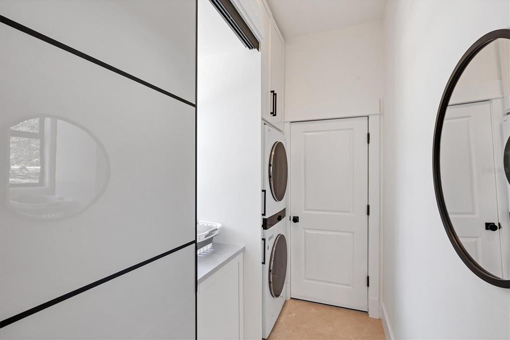 4624 Pompano Street Placida, FL 33946 - Photo 23 of 39 a view of a hallway with washer and dryer