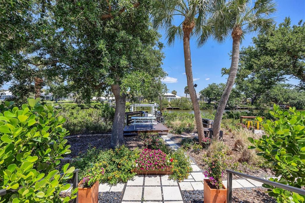 4624 Pompano Street Placida, FL 33946 - Photo 26 of 39 a view of backyard with outdoor seating