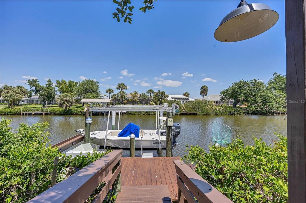 4624 Pompano Street Placida, FL 33946 - Photo 27 of 39 a view of a lake from a balcony