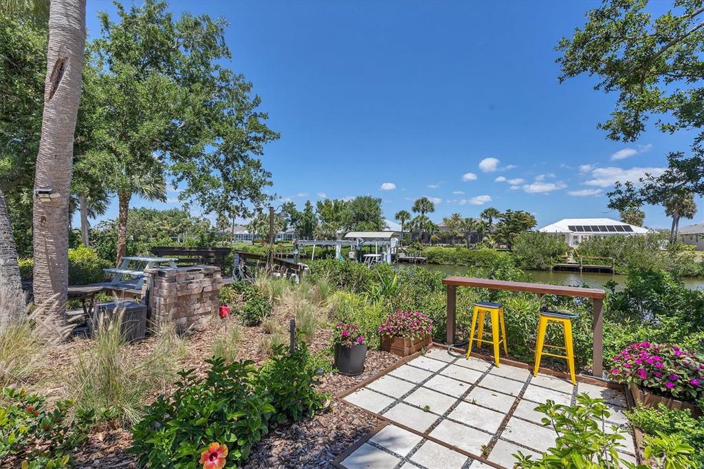 4624 Pompano Street Placida, FL 33946 - Photo 29 of 39 a view of a chair and table on the terrace