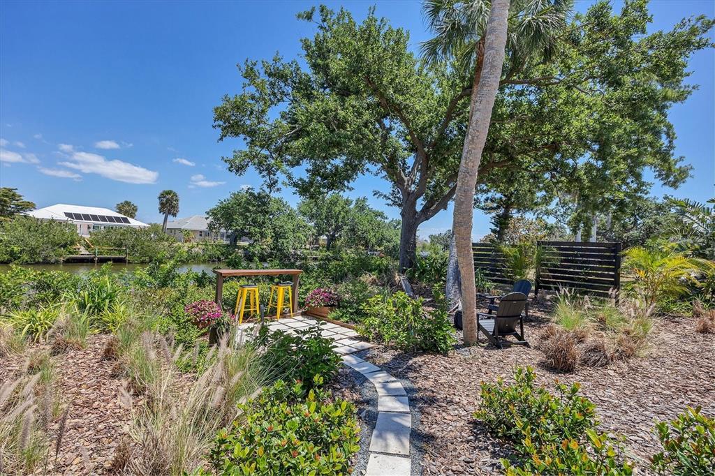 4624 Pompano Street Placida, FL 33946 - Photo 30 of 39 a view of garden with plants and trees