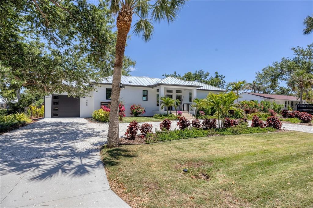 4624 Pompano Street Placida, FL 33946 - Photo 38 of 39 a view of a street with cars parked