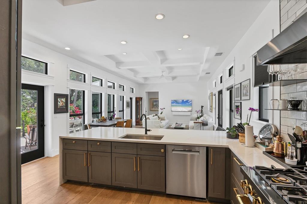 4624 Pompano Street Placida, FL 33946 - Photo 8 of 39 a kitchen with stainless steel appliances a sink stove and cabinets