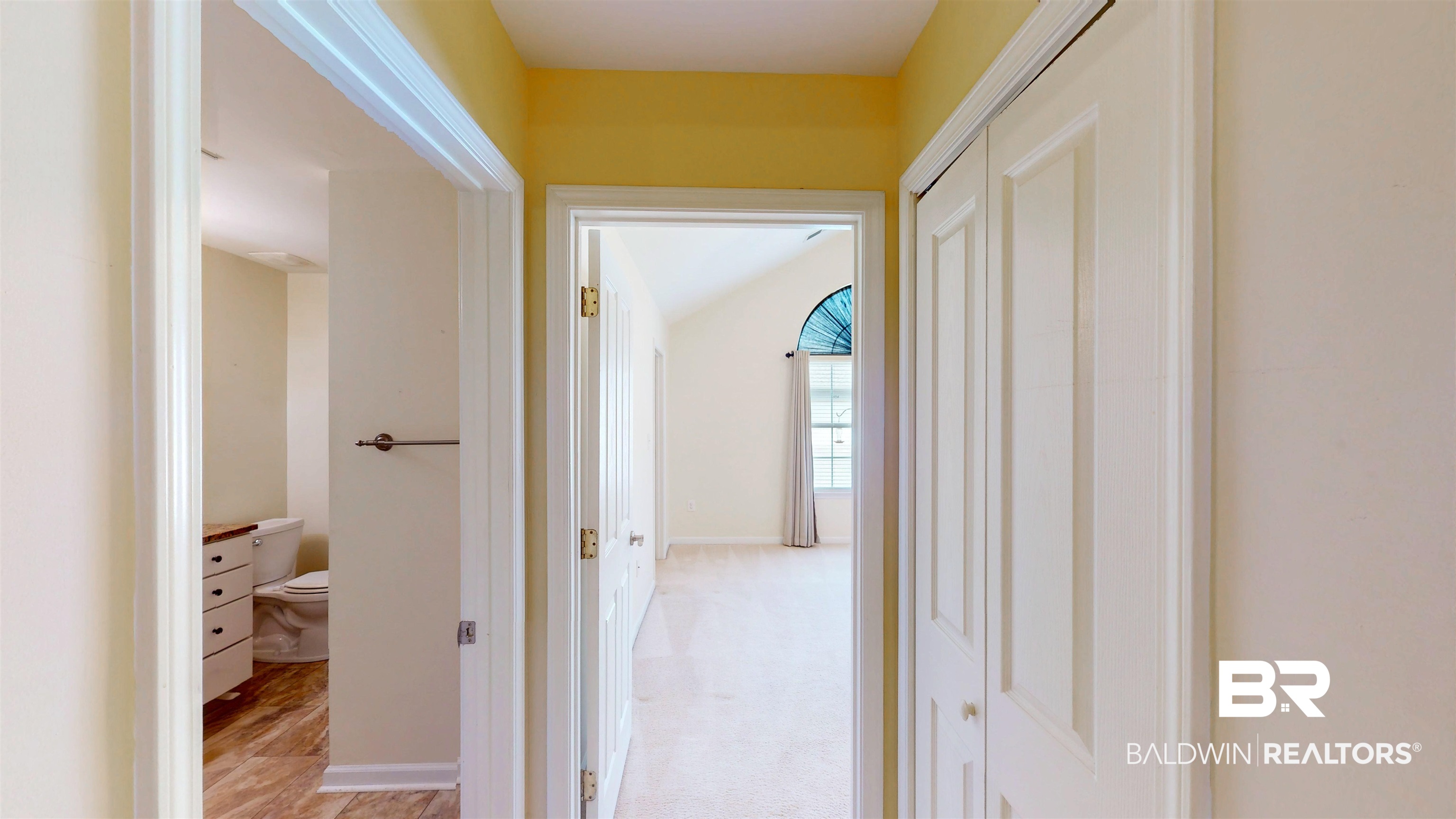 303 Wyld Palms Drive, Unit 303 Foley, AL 36535 - Photo 16 of 36 Corridor with light colored carpet and baseboards