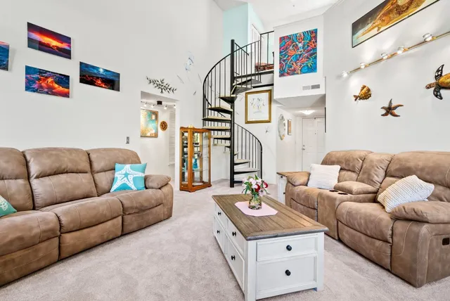 a living room with furniture and a white couch