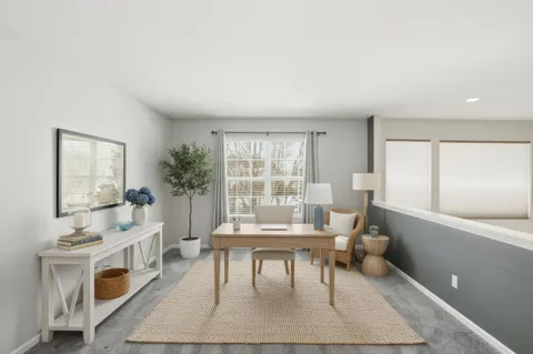 a living room with furniture and a table