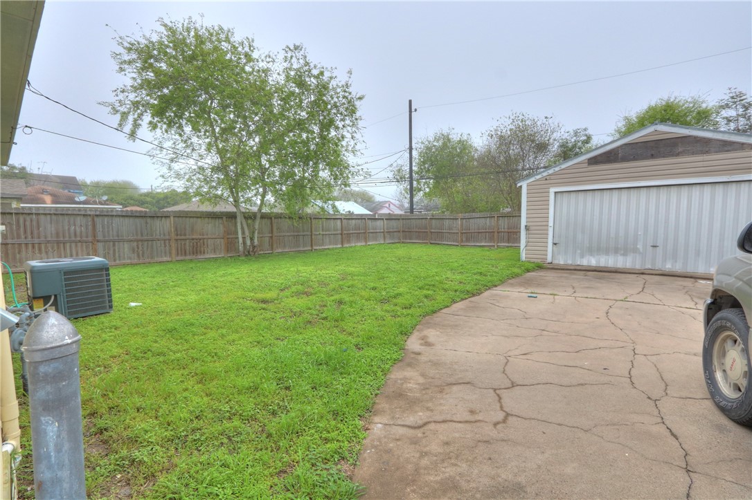 3538 Austin Street Corpus Christi, TX 78411 - Photo 20 of 21 a view of a backyard with a garden and trees