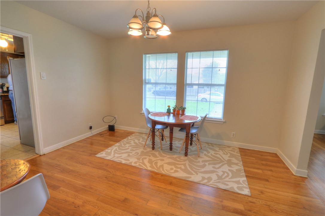 3538 Austin Street Corpus Christi, TX 78411 - Photo 8 of 21 a view of a dining room with furniture window and wooden floor