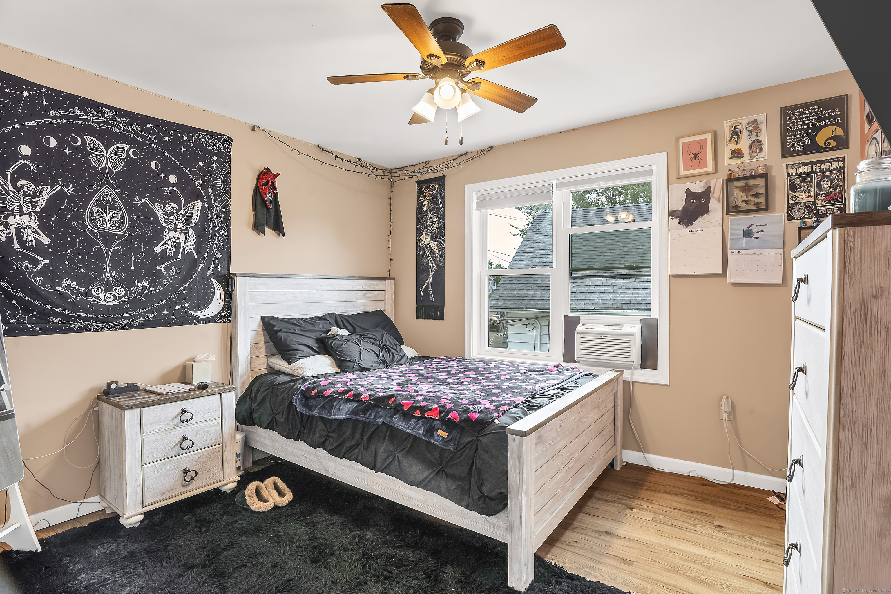 132 Howard Avenue Ansonia, CT 06401 - Photo 13 of 16 a bedroom with a bed and a window