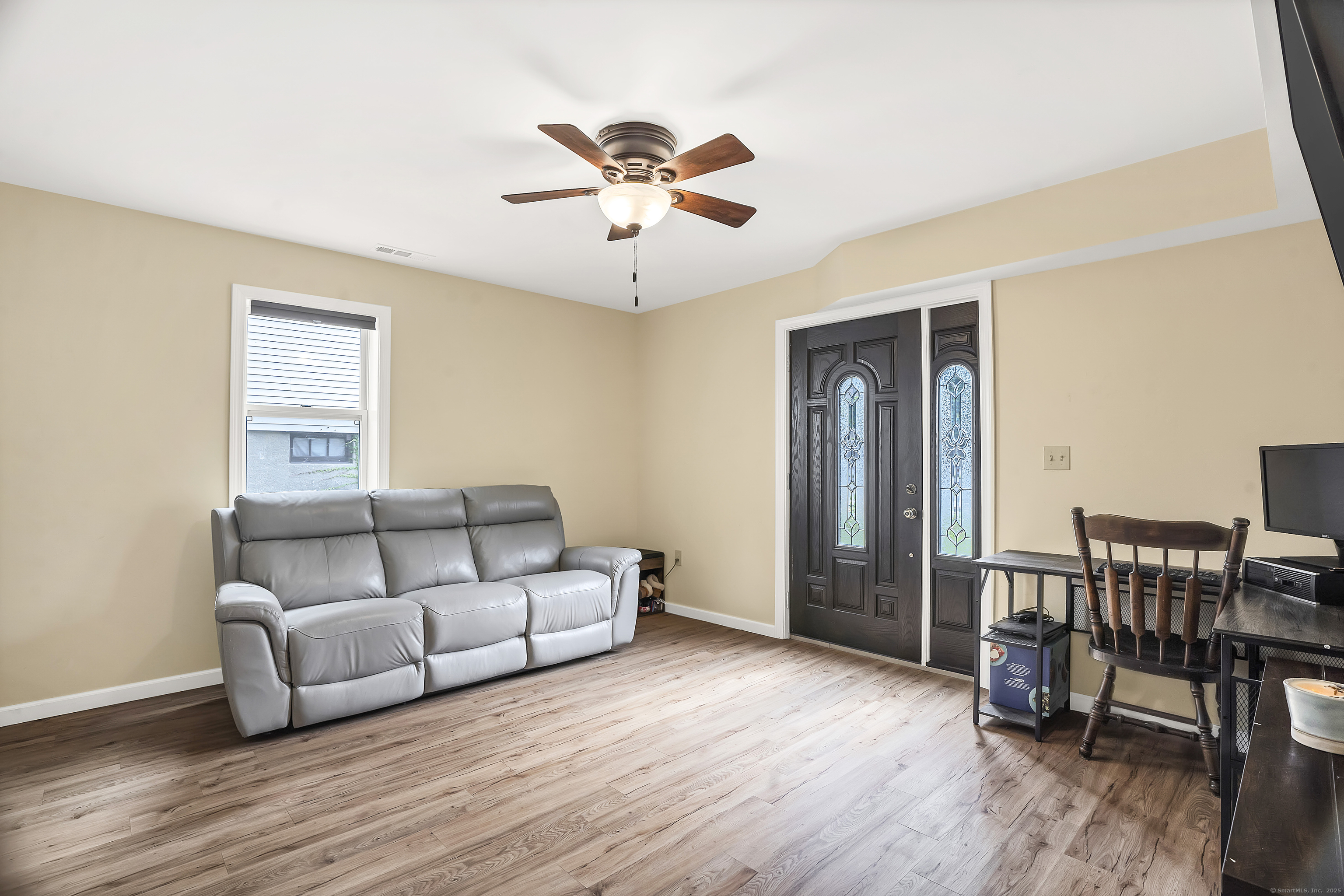 132 Howard Avenue Ansonia, CT 06401 - Photo 3 of 16 a living room with furniture and a wooden floor