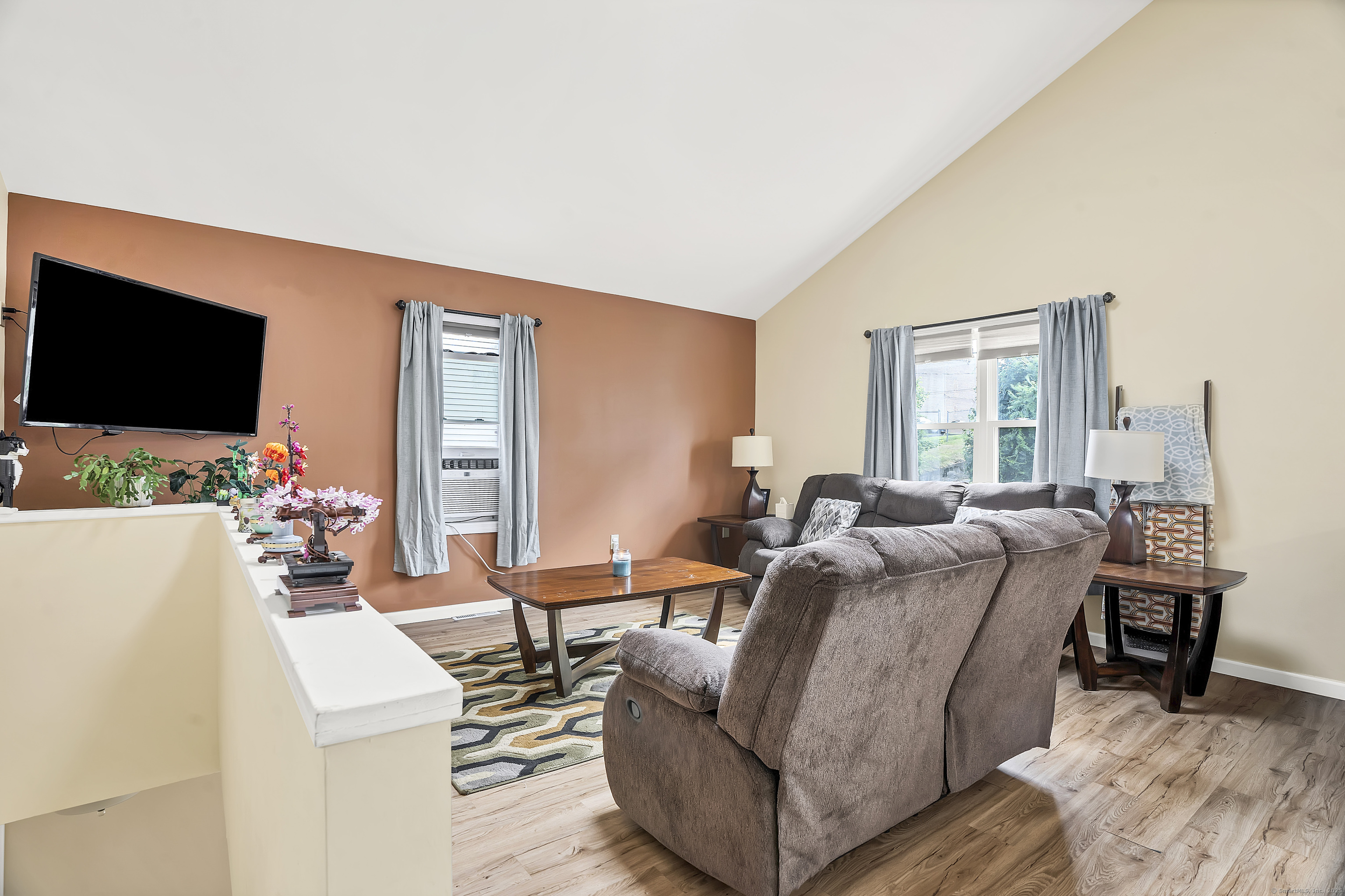 132 Howard Avenue Ansonia, CT 06401 - Photo 6 of 16 a living room with furniture and a flat screen tv