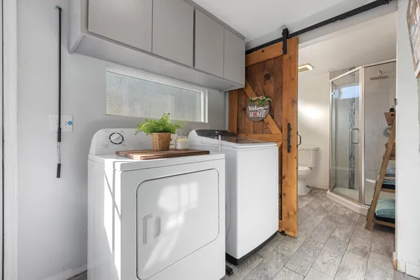 a kitchen with a sink and refrigerator