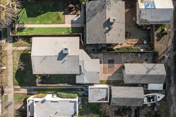 an aerial view of residential houses with outdoor space