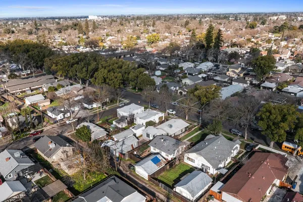 an aerial view of residential houses with outdoor space