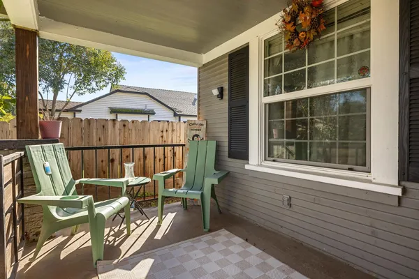 a view of a deck with wooden floor and outdoor seating