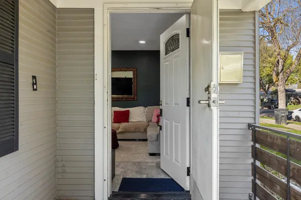 a view of a hallway with a outdoor space