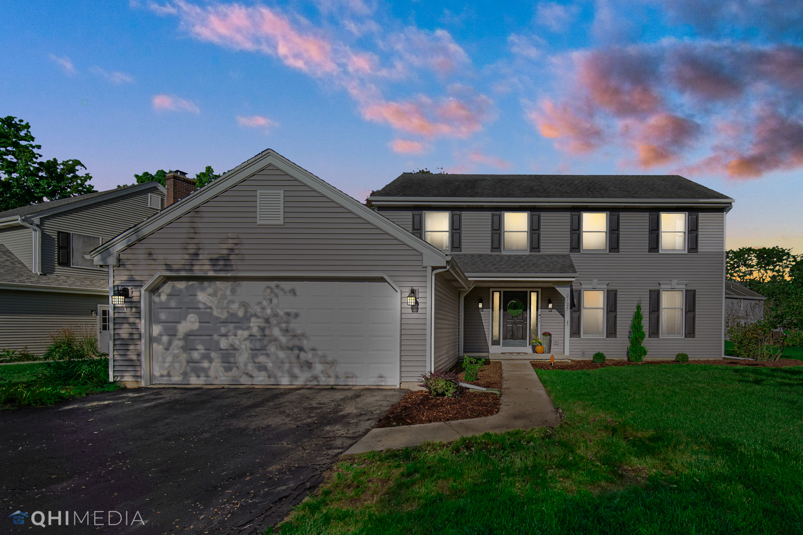 2125 Forest Ridge Road St. Charles, IL 60174 - Photo 2 of 28 a front view of a house with a yard and garage