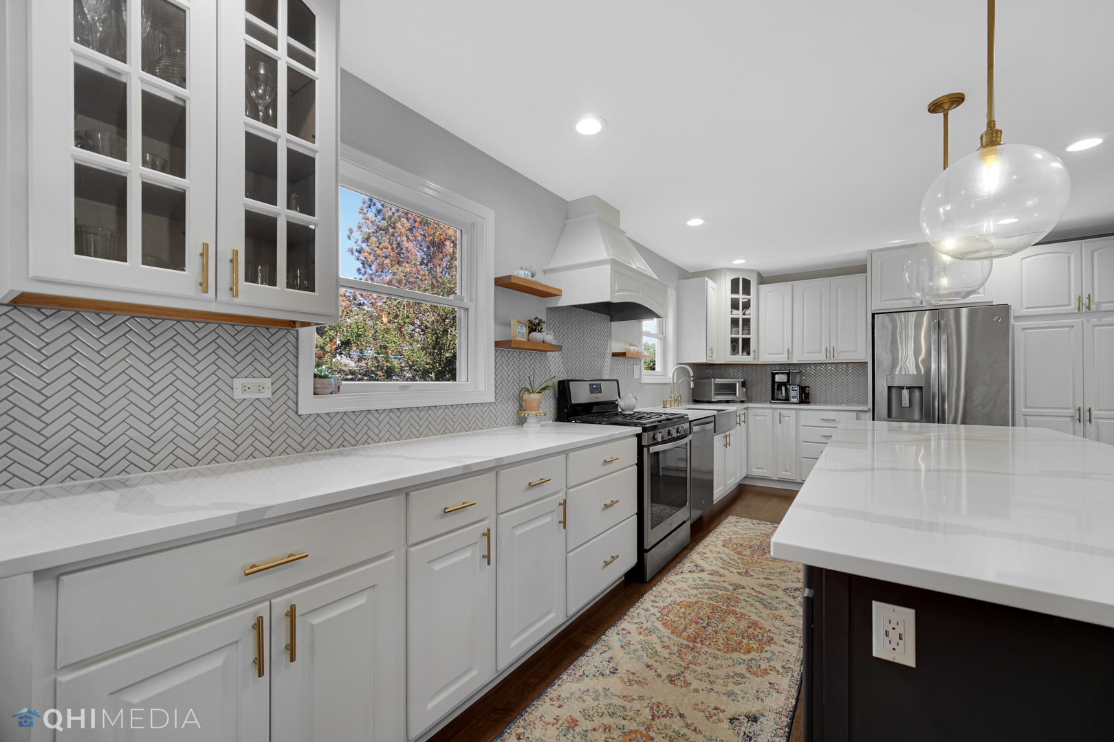 2125 Forest Ridge Road St. Charles, IL 60174 - Photo 12 of 28 a large kitchen with stainless steel appliances kitchen island granite countertop a sink and cabinets